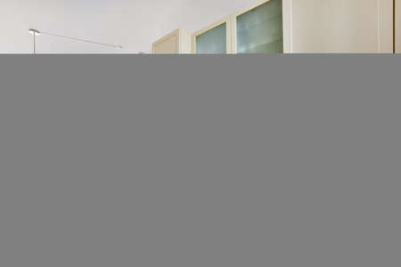 Beautiful and spacious kitchen in an elegant homeの写真素材