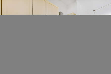 Beautiful and spacious kitchen in an elegant homeの写真素材