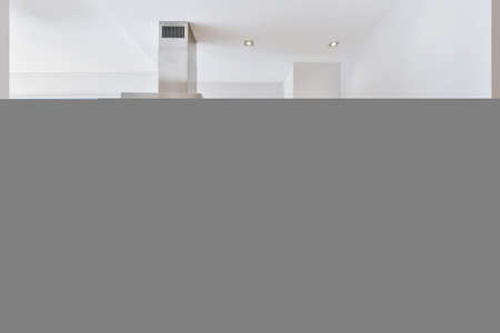 Beautiful and spacious kitchen in an elegant homeの写真素材