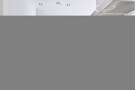 Beautiful and spacious kitchen in an elegant homeの写真素材