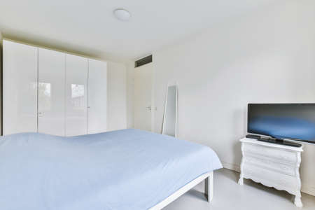 Bright and stylish bedroom with luxury furnitureの写真素材