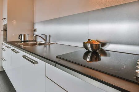 Beautiful and spacious kitchen in an elegant homeの写真素材