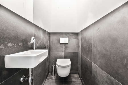 Interior of small clean restroom in miniature styleの写真素材