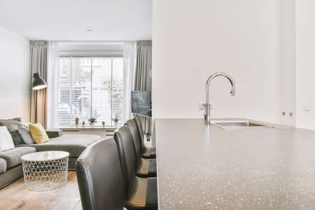 Stylish dining interior design with chairs and kitchen