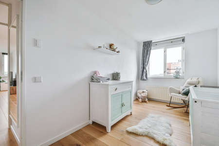 Beautiful bright childrens room in elegant apartmentの写真素材