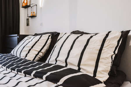 Interior of a cozy and bright bedroom with beautiful decoration