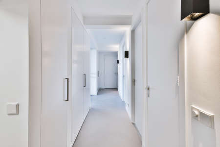 Stylish bright corridor with lots of doors