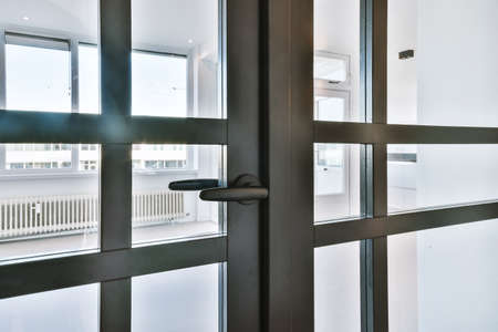 Pretty glass door with wood inserts in apartment