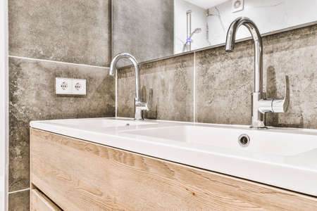 Close up of stylish faucet in modern bathroomの写真素材