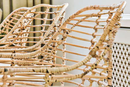 Wicker bamboo chairs in luxury dining roomの写真素材