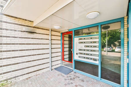 The entrance part of the house with mailboxes from the street side