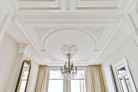 Beautiful patterned ceiling and elegant crystal chandelier