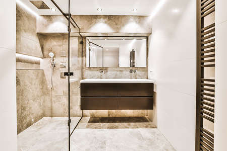 Elegant bathroom decor with marble walls and floorsの写真素材