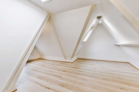 Stylish minimalistic attic room in comfortable houseの写真素材