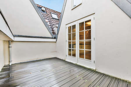 Beautiful veranda after rain with white door