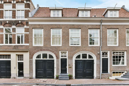 Stylish exterior of house with black entrance