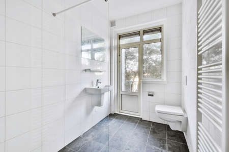 Modern toilet in a bright dwelling bathroom