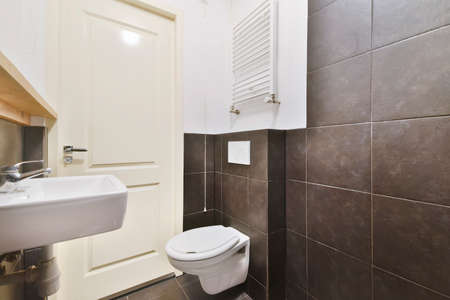 Interior of small clean bathroom in miniature style