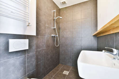 Interior of small clean bathroom in miniature style