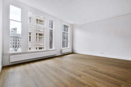 A spacious room with large windows on the whole roomの写真素材