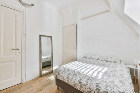The interior of a delightful bedroom in light tones