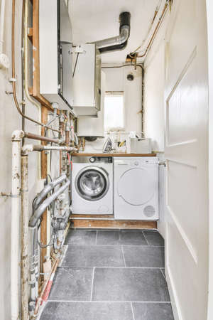Aroom with a washing machine and dryerの写真素材