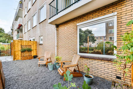 Pretty courtyard design with two wooden benches