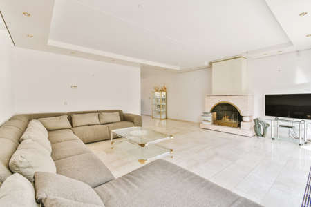 Design of the living room with big sofa on the whole wallの写真素材