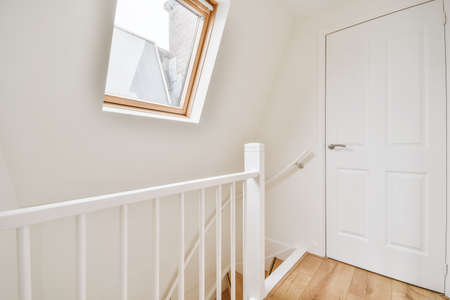 Small bright room with a window on the wall