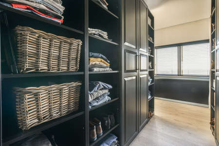 Wardrobe and cabinet in light room at homeの写真素材