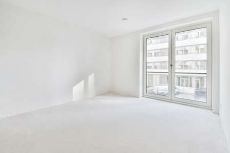 A completely white room in an elegant apartmentの写真素材