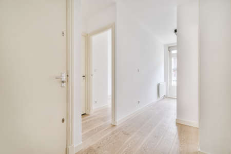 Interior of a spacious room with beautifully laid parquet in an elite houseの写真素材