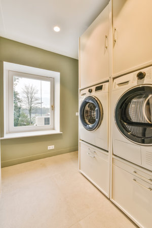 Cozy small room with a washing machines in an apartmentの写真素材