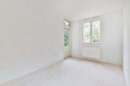 White room with windows in an elegant residential buildingの写真素材