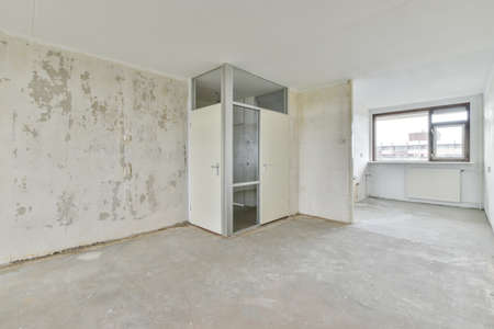 Delightful and cozy room with large windows and parquet floorsの写真素材