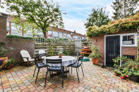 Lovely courtyard of the house with outdoor tables and chairs