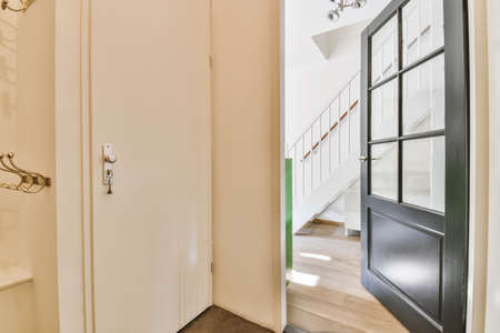 Interior of contemporary flat in minimal style with spacious hallway with white wallsの写真素材