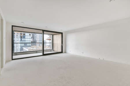 Modern room with wooden floor and white wallsの写真素材
