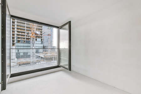 Modern room with wooden floor and white wallsの写真素材