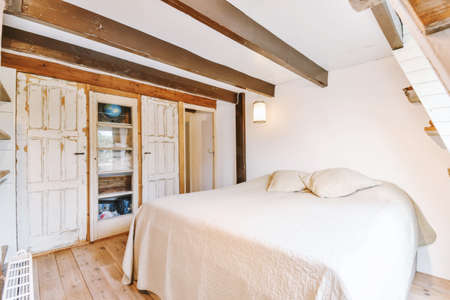 Double bedroom with soft and firm mattressの写真素材