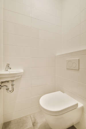 Interior of small clean restroom in miniature styleの写真素材