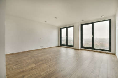 Modern room with wooden floor and white walls