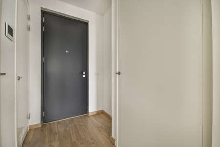 Modern room with wooden floor and white wallsの写真素材