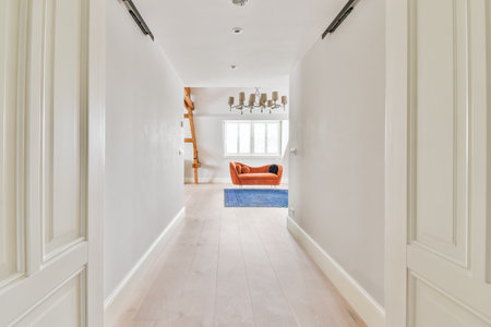 Long stunning hallway with wood flooring and white wallsの写真素材