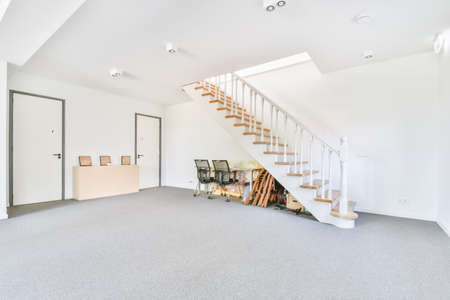 Straight white staircase to the second floor