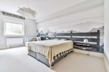 Bedroom in a minimalist style with a double bed