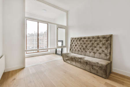 Modern room with wooden floor and white wallsの写真素材