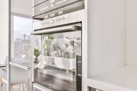 Attractive kitchen with stylish and modern ovenの写真素材