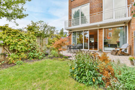 The backyard of a charming house with a summer dining roomの写真素材