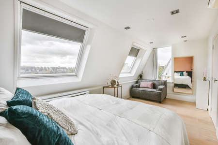 Cozy bedroom with an excellent and comfortable soft bedの写真素材